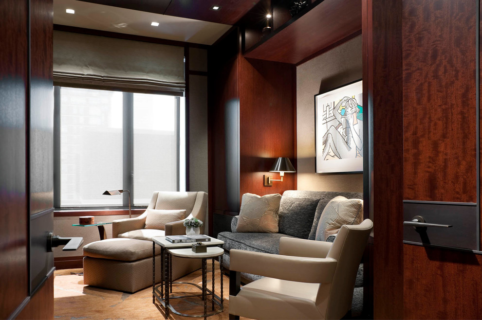 Immagine di un soggiorno design con libreria