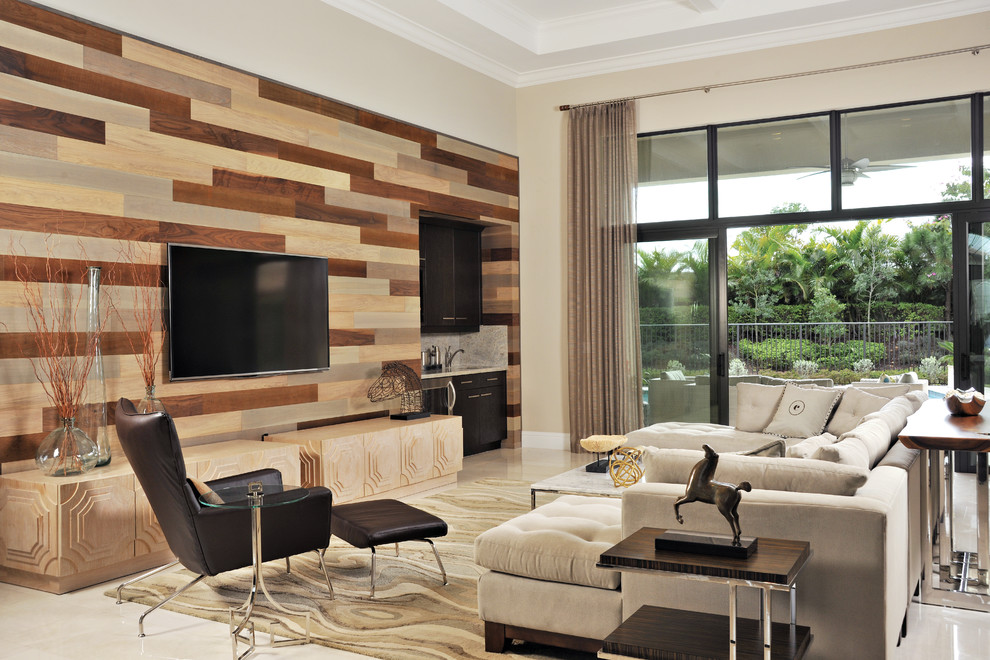 Large contemporary open plan games room in Miami with a home bar, a wall mounted tv, beige walls, marble flooring and no fireplace.