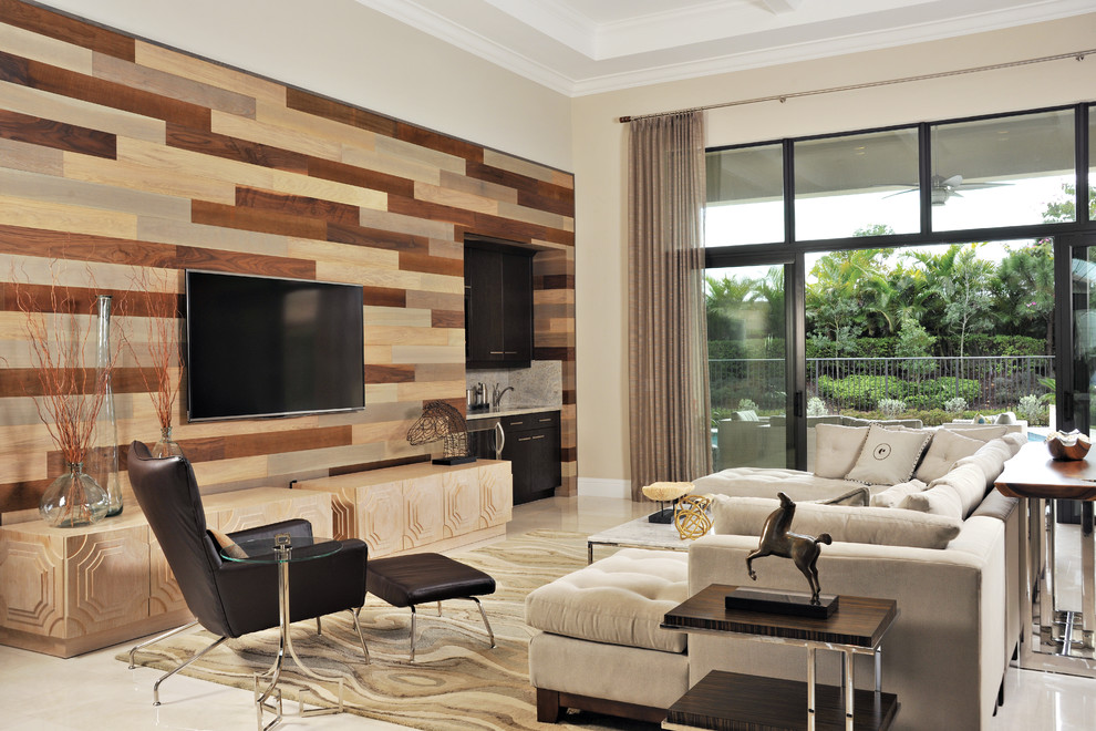 Family room - large contemporary open concept marble floor family room idea in Miami with a bar, a wall-mounted tv, beige walls and no fireplace