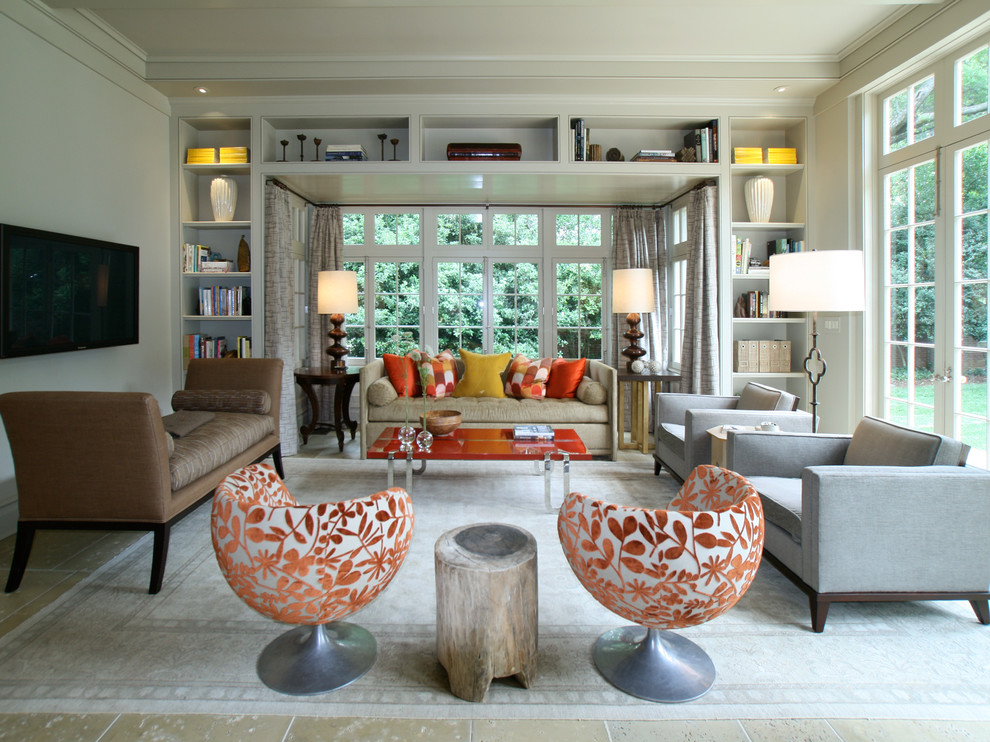 Trendy family room photo in Charlotte with beige walls and a wall-mounted tv
