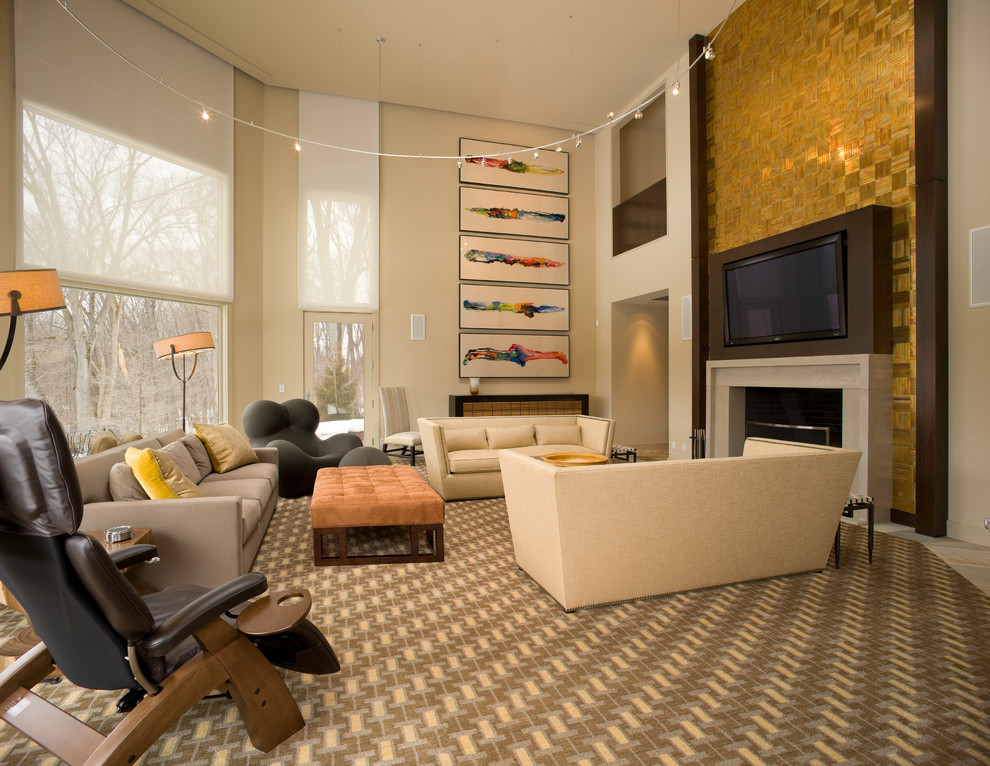 Family room - contemporary carpeted and multicolored floor family room idea in New York with beige walls, a standard fireplace and a media wall