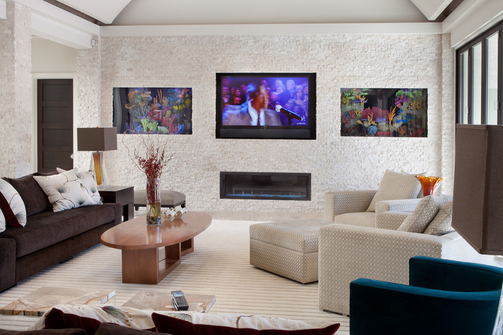 This is an example of a contemporary games room in Other with a ribbon fireplace, a stone fireplace surround and a wall mounted tv.