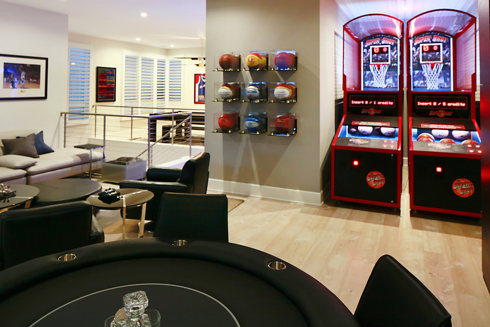 Large contemporary open plan games room in Los Angeles with a game room, white walls, light hardwood flooring, no fireplace, a built-in media unit and beige floors.