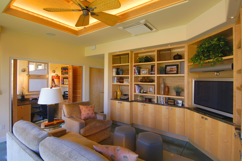 Small contemporary games room in Hawaii with yellow walls, concrete flooring and a built-in media unit.