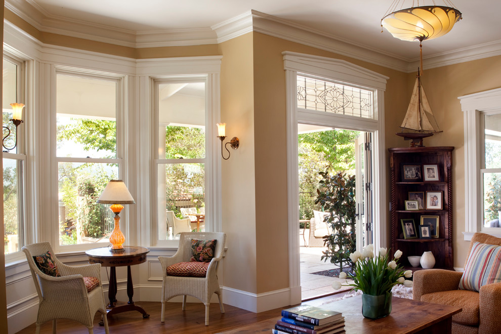 Inspiration for a large timeless open concept medium tone wood floor family room remodel in San Francisco