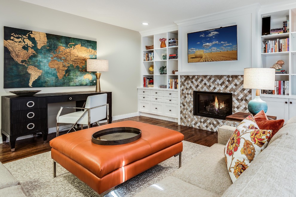 Family room - transitional family room idea in Calgary with a standard fireplace, a tile fireplace, a wall-mounted tv and beige walls