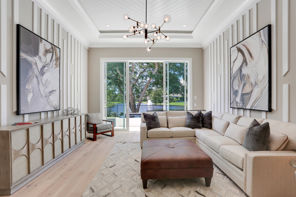 Example of a large transitional enclosed shiplap ceiling and wall paneling family room design in Miami