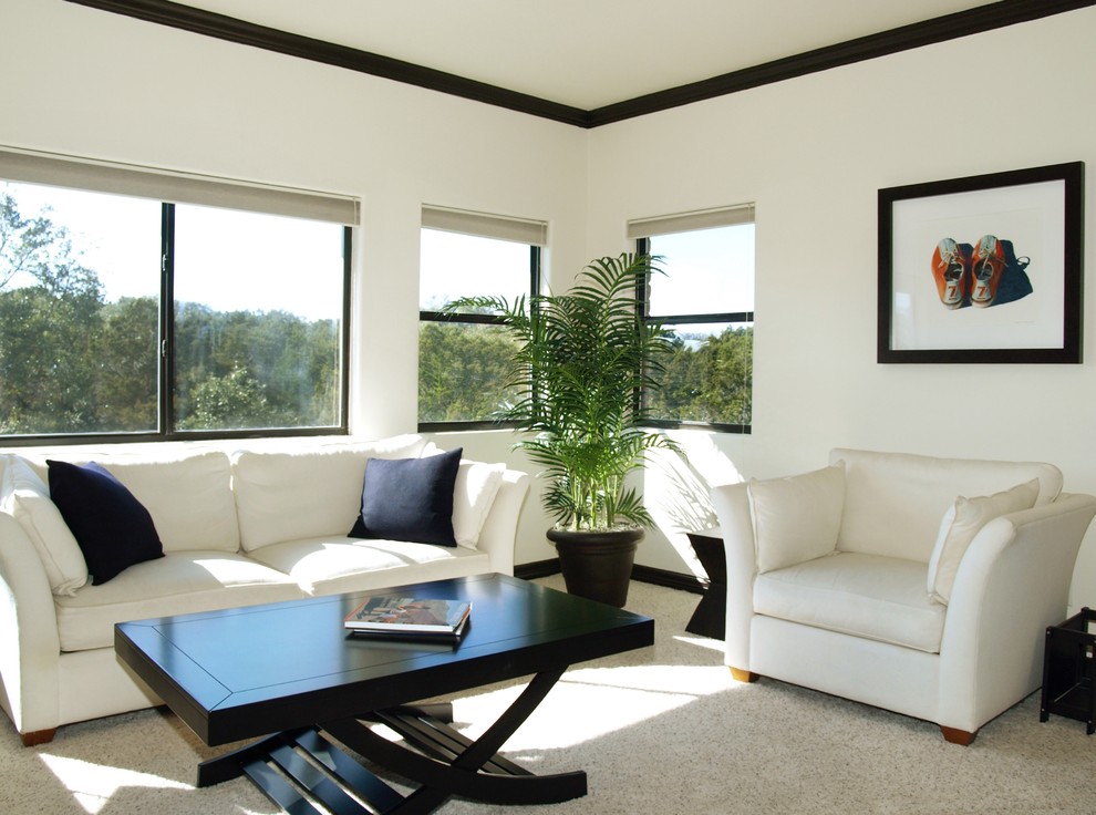 Diseño de sala de estar con biblioteca tipo loft contemporánea de tamaño medio con paredes blancas y moqueta