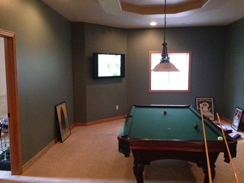 Mediterranean games room in Denver with a game room, green walls and a wall mounted tv.