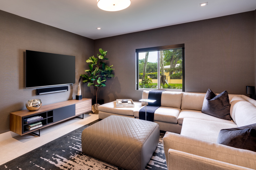 This is an example of a medium sized contemporary open plan games room in Miami with grey walls, porcelain flooring, a wall mounted tv and beige floors.