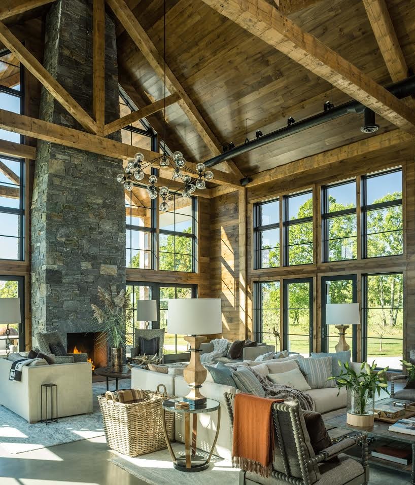 Design ideas for an expansive farmhouse open plan games room in Burlington with brown walls, concrete flooring, a standard fireplace, a stone fireplace surround and no tv.