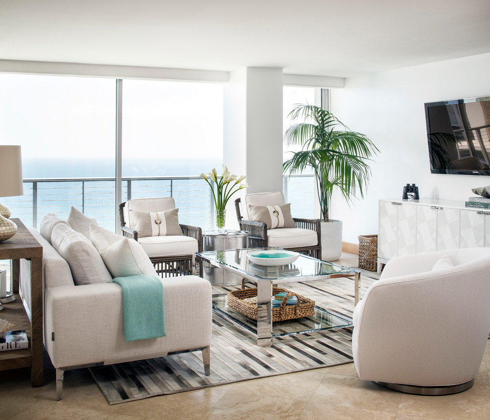 Свежая идея для дизайна: открытая гостиная комната среднего размера в морском стиле с белыми стенами, телевизором на стене и бежевым полом - отличное фото интерьера