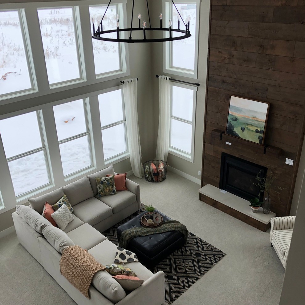 Family room - large farmhouse open concept carpeted and beige floor family room idea in Other with gray walls, a standard fireplace and a wood fireplace surround