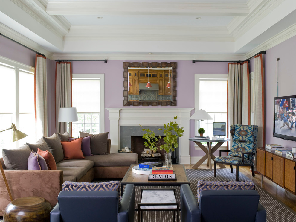 На фото: большая изолированная гостиная комната в современном стиле с фиолетовыми стенами, паркетным полом среднего тона, стандартным камином, телевизором на стене, фасадом камина из дерева и коричневым полом с
