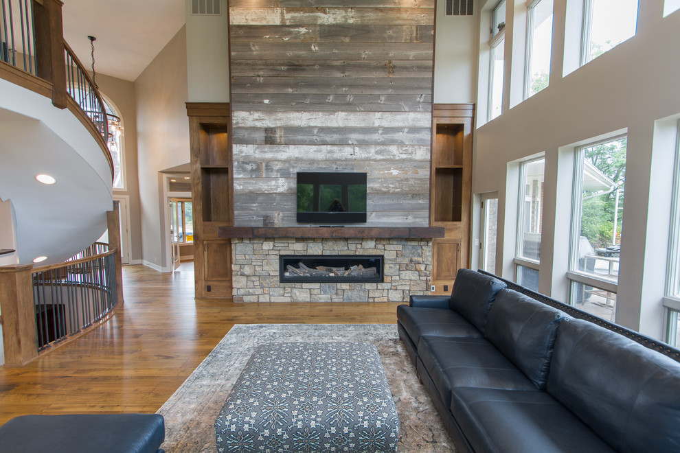 Rustic games room in Omaha with a ribbon fireplace.