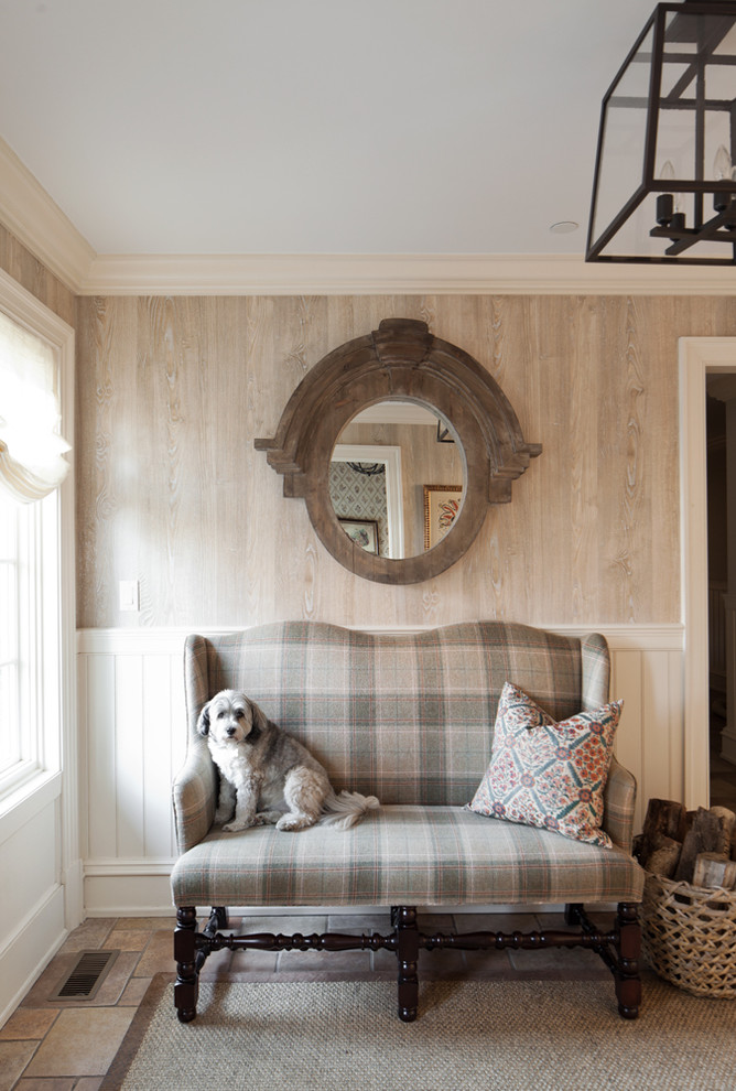 Inspiration for a large timeless medium tone wood floor family room remodel in New York with beige walls