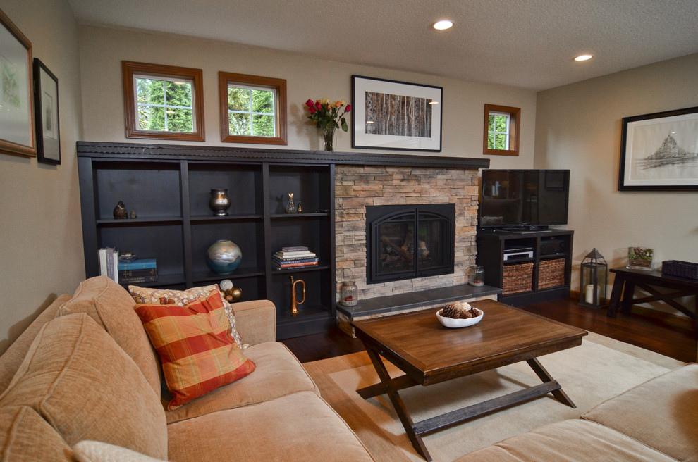 Mid-sized arts and crafts dark wood floor family room photo in Portland with yellow walls, a standard fireplace, a stone fireplace and a tv stand
