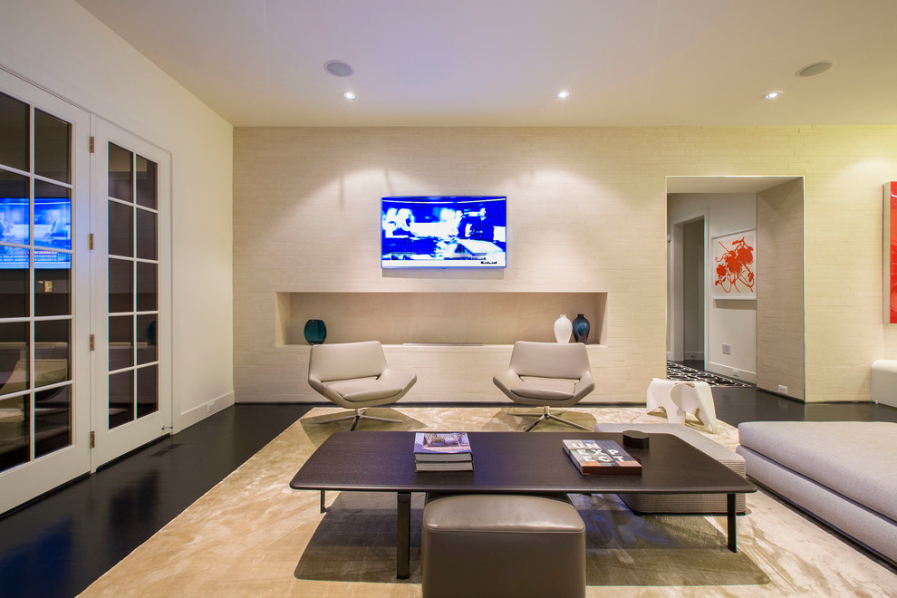 Example of a large minimalist open concept dark wood floor family room design in DC Metro with beige walls, a tile fireplace and a wall-mounted tv