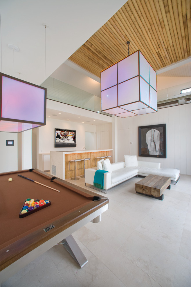 This is an example of a contemporary games room in New York with beige floors.