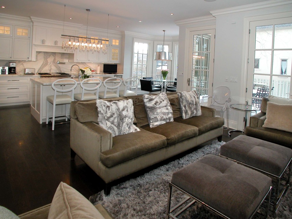 Example of a mid-sized transitional open concept medium tone wood floor and brown floor family room design in Toronto with gray walls, no fireplace and no tv