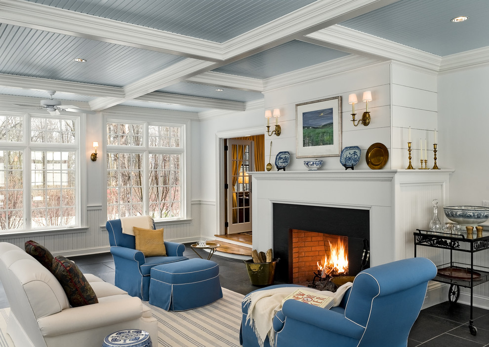Elegant family room photo in New York with white walls