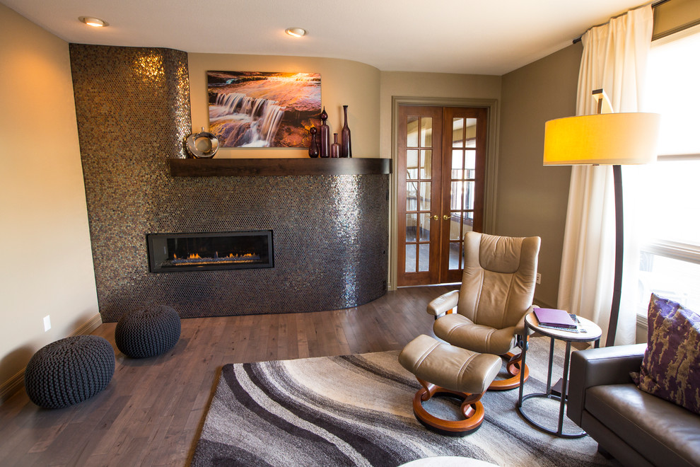 Mid-sized trendy open concept dark wood floor and brown floor family room photo in Denver with beige walls, a ribbon fireplace, a tile fireplace and a tv stand