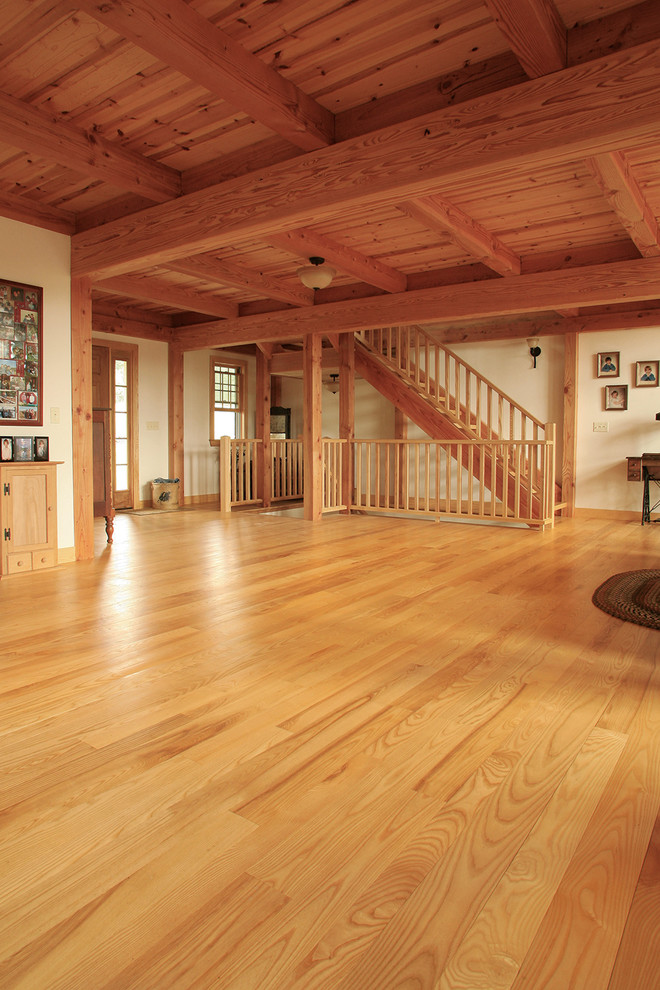 Example of a large trendy open concept light wood floor family room design in Boston with beige walls
