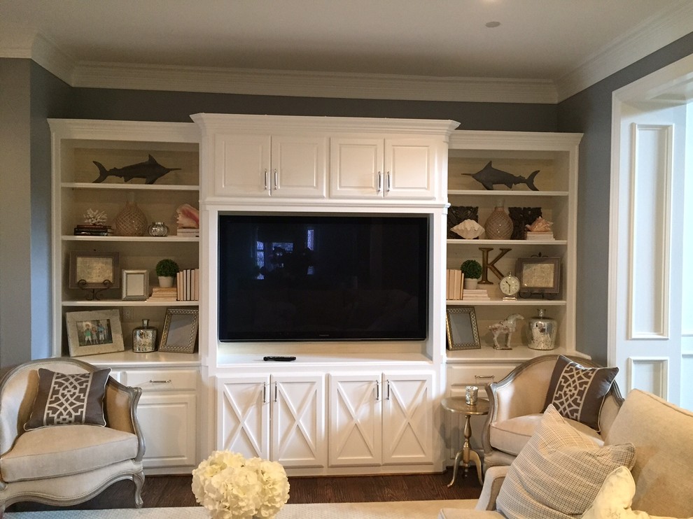 Family room library - small traditional enclosed medium tone wood floor family room library idea in Dallas with gray walls, no fireplace and a media wall