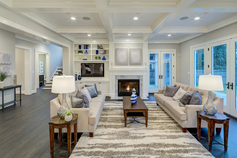 Inspiration for a large transitional open concept dark wood floor and brown floor family room remodel in DC Metro with gray walls, a standard fireplace, a stone fireplace and a media wall