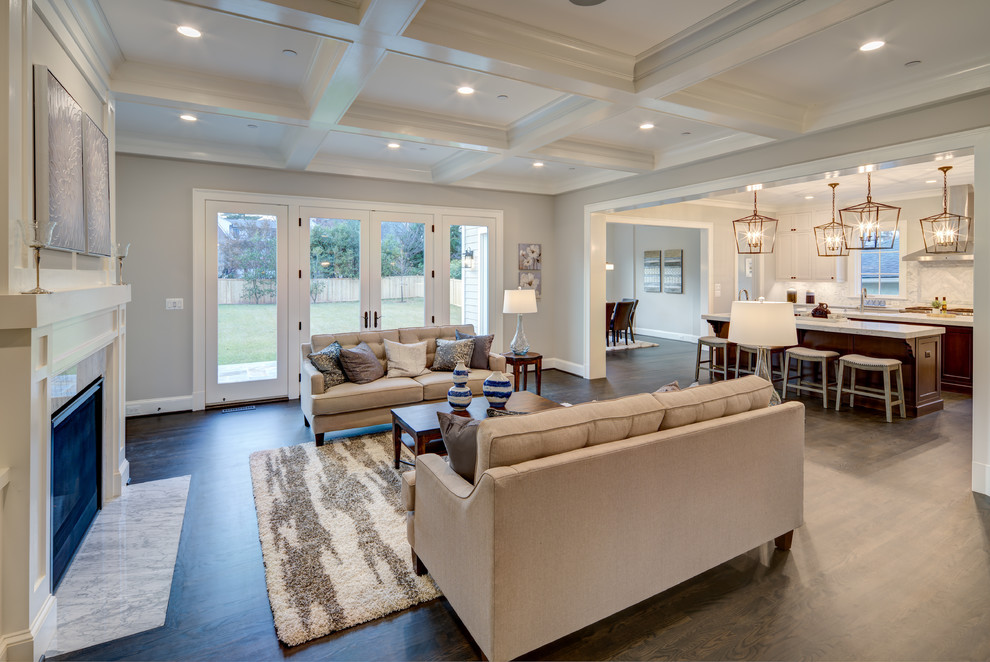 Photo of a large traditional open plan games room in DC Metro with grey walls, dark hardwood flooring, a standard fireplace, a stone fireplace surround, a built-in media unit and brown floors.