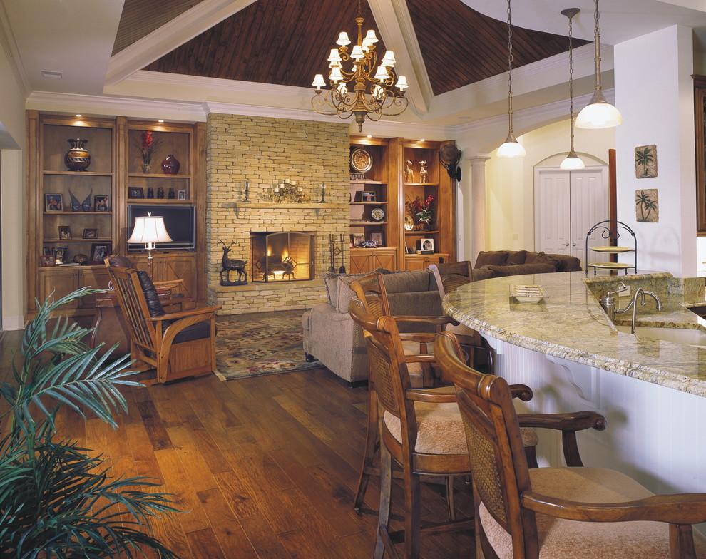 Exemple d'une grande salle de séjour bord de mer ouverte avec un mur vert, un sol en carrelage de céramique et une cheminée standard.