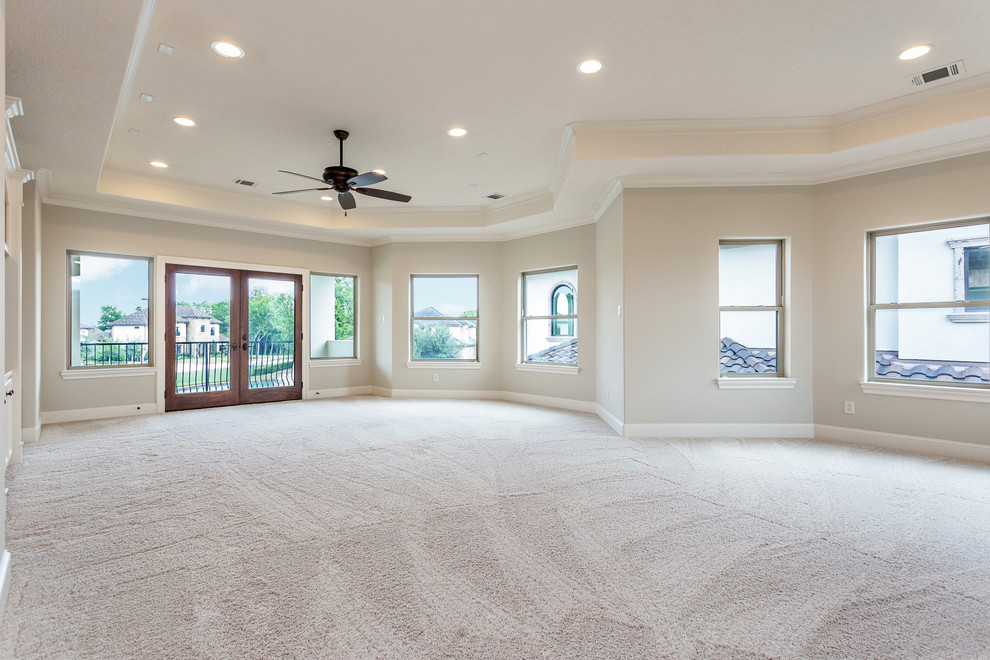 Photo of a large mediterranean enclosed games room in Houston with a game room, grey walls, carpet, a built-in media unit and grey floors.