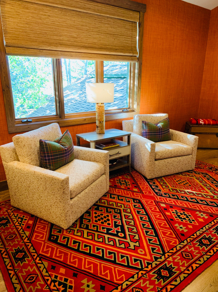 Games room in Denver with red walls, medium hardwood flooring and beige floors.