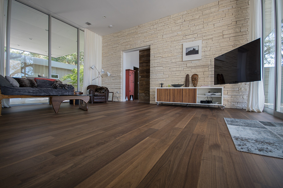 Ispirazione per un soggiorno moderno con pavimento in legno massello medio