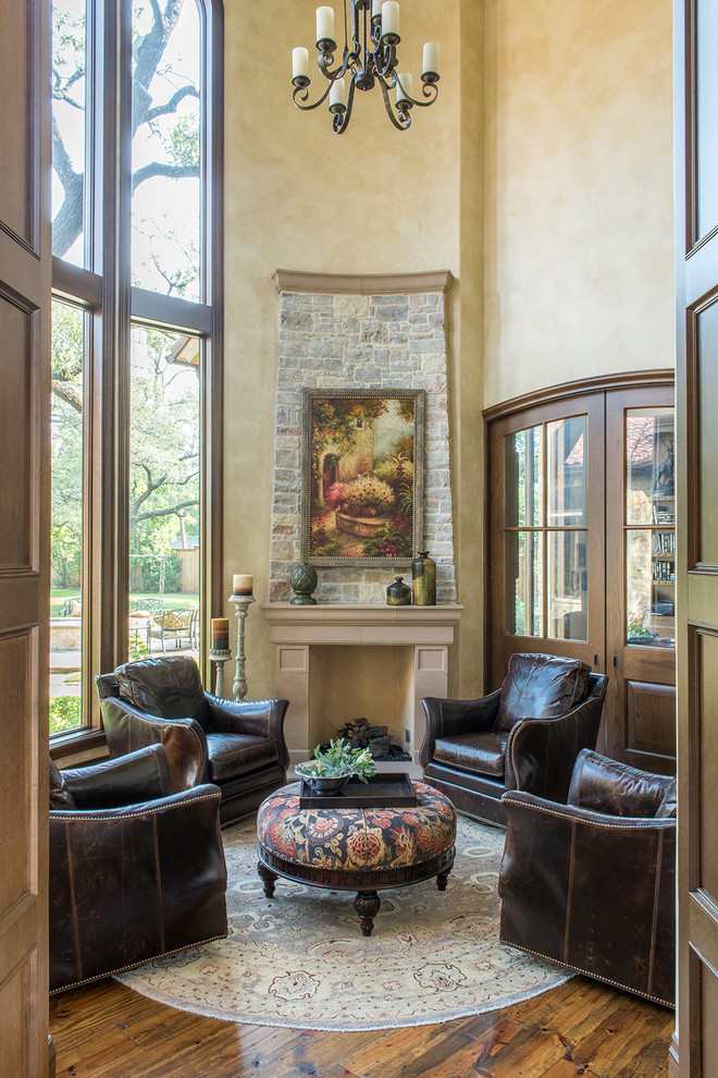 Medium sized classic enclosed games room in Dallas with a reading nook, medium hardwood flooring, a standard fireplace and a stone fireplace surround.