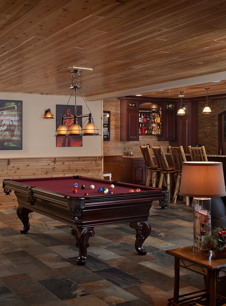 Design ideas for a small rustic games room in Grand Rapids with slate flooring.