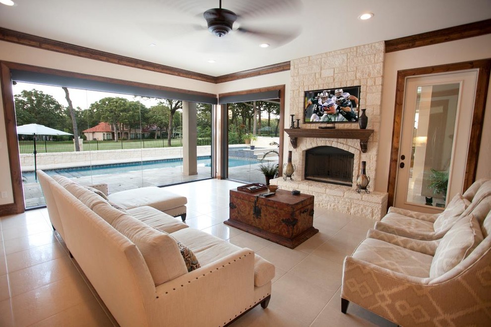 Example of a large tuscan open concept travertine floor family room design in Austin with a wall-mounted tv, white walls and a ribbon fireplace