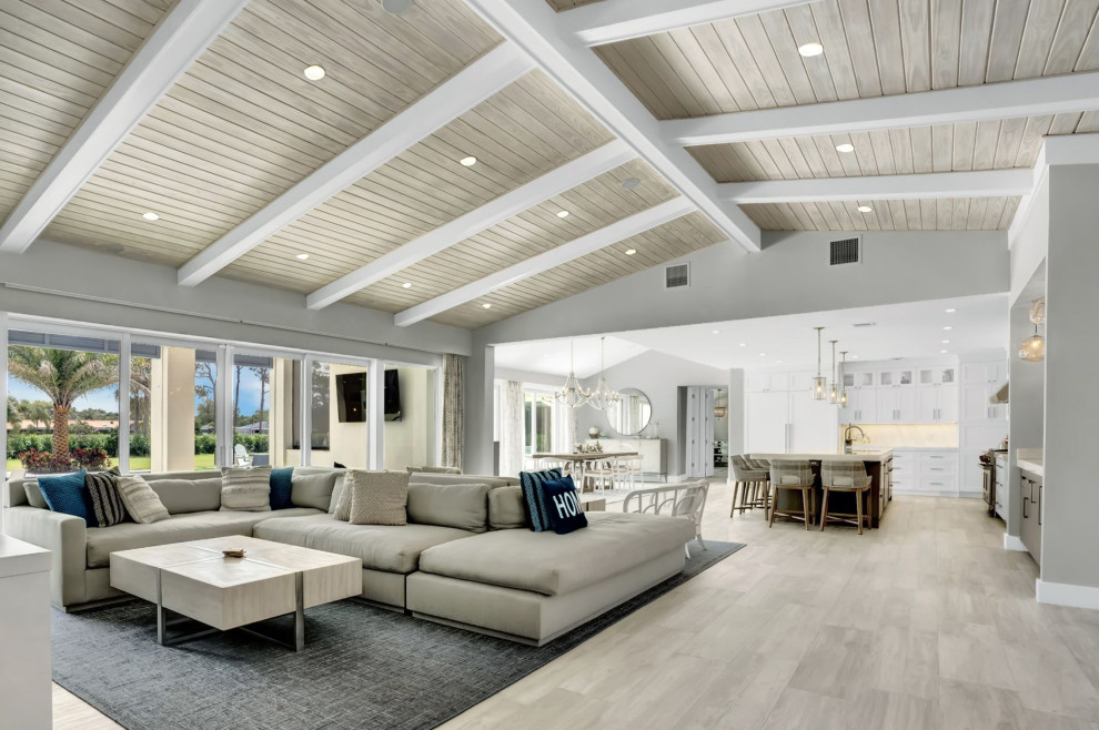 Design ideas for an expansive nautical open plan games room in Miami with white walls, porcelain flooring, a wall mounted tv, grey floors, a timber clad ceiling and wallpapered walls.