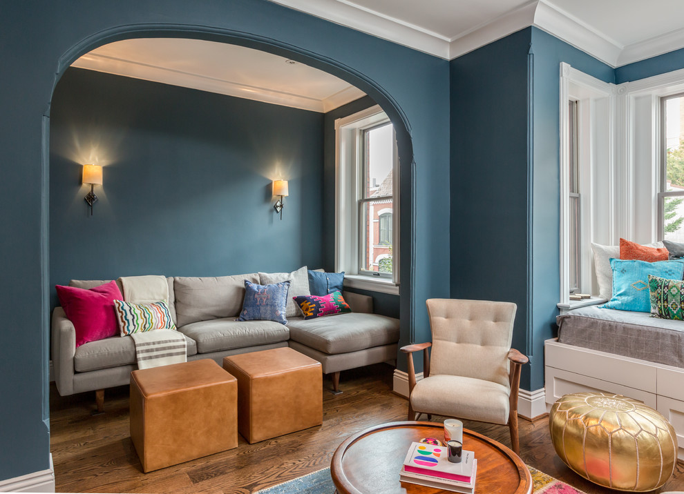 Inspiration for an eclectic dark wood floor family room remodel in DC Metro with blue walls