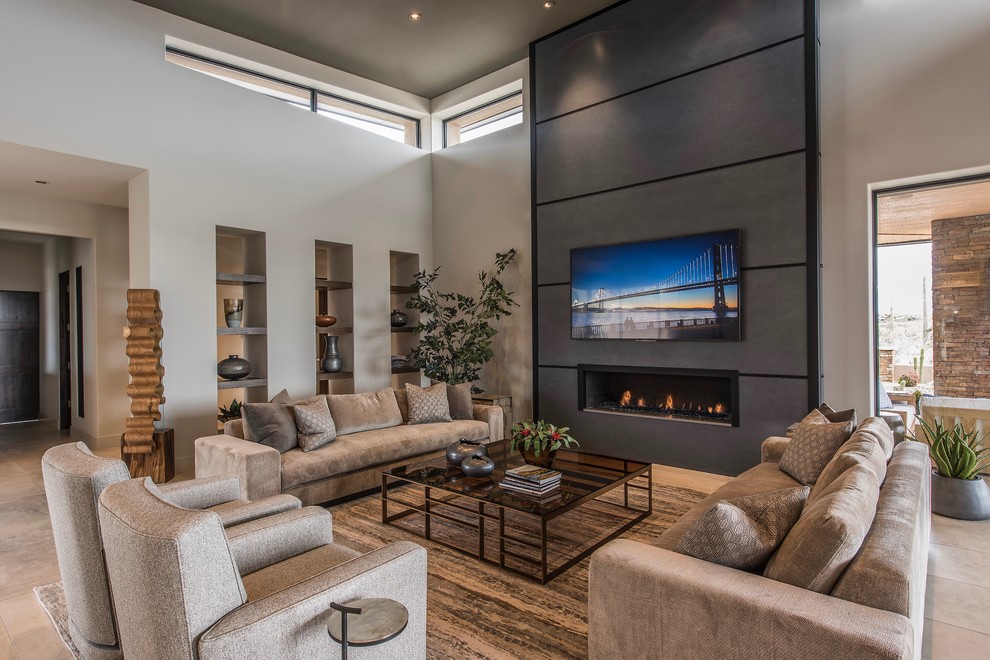 Photo of a large contemporary open plan games room in Phoenix with beige walls, porcelain flooring, a ribbon fireplace, a concrete fireplace surround, a wall mounted tv and beige floors.
