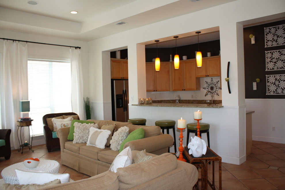 Example of a large beach style open concept ceramic tile family room design in Miami with white walls