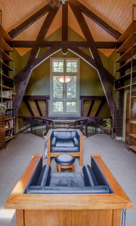 Inspiration for a large craftsman loft-style carpeted family room library remodel in New York with green walls, no fireplace and no tv