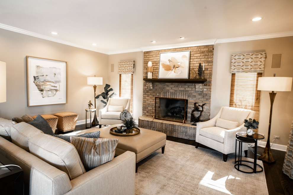 Inspiration for a large transitional open concept medium tone wood floor and brown floor family room remodel in Chicago with beige walls, a standard fireplace and a brick fireplace