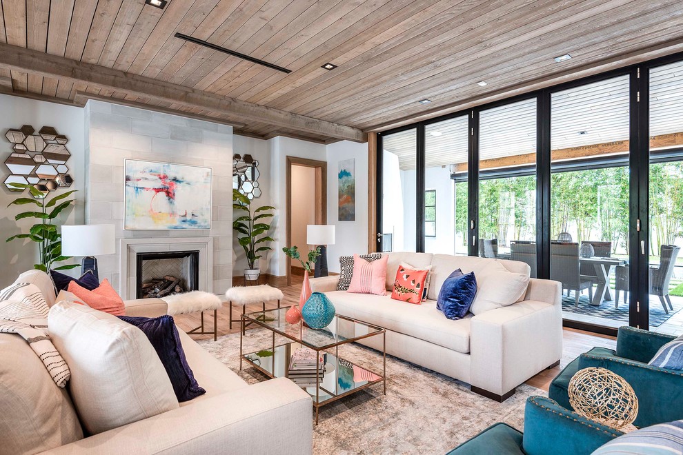 Inspiration for a large transitional open concept family room remodel in Orlando with white walls, a standard fireplace, a concrete fireplace and no tv