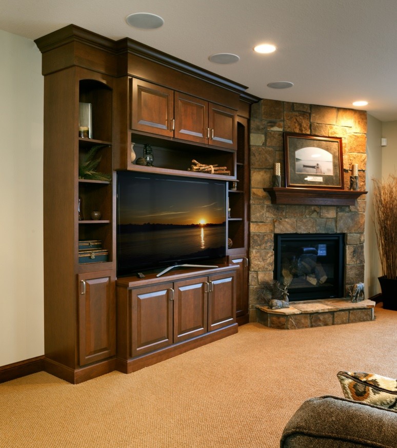 Family room - traditional carpeted family room idea in Other with a bar and a media wall