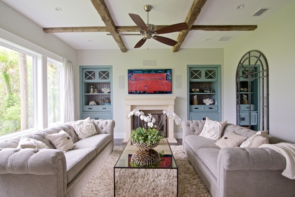 Beach style family room photo in Jacksonville with a wall-mounted tv