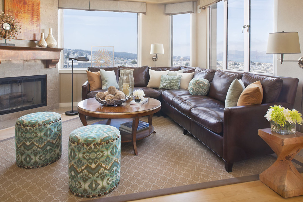 Family room - traditional light wood floor family room idea in San Francisco with beige walls and a corner fireplace
