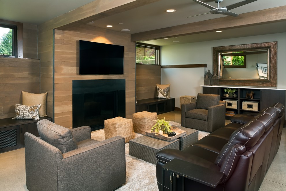 Diseño de sala de estar contemporánea grande con suelo de cemento, televisor colgado en la pared y todas las chimeneas