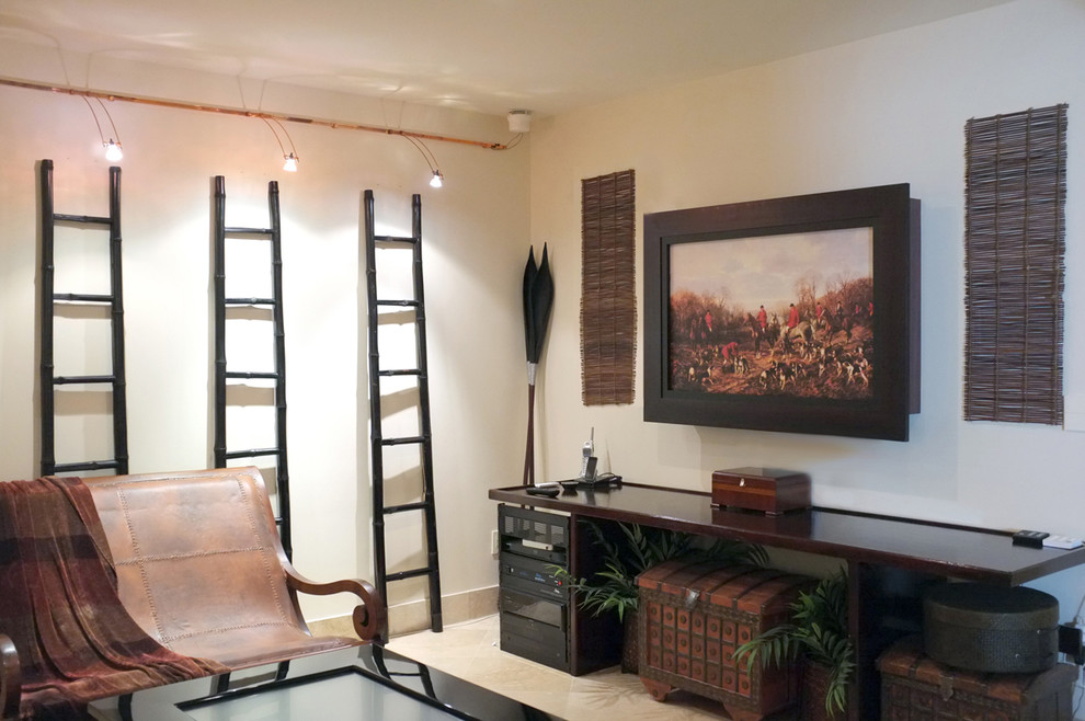 This is an example of a bohemian games room in Miami with a concealed tv.
