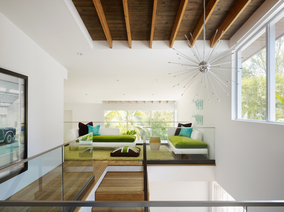 Mid-century modern loft-style family room photo in Los Angeles with white walls